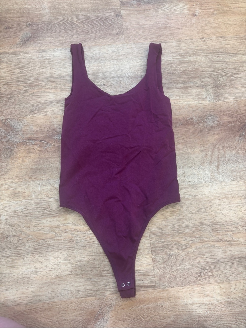 Free People Sleeveless Scoop Bodysuit in Plum